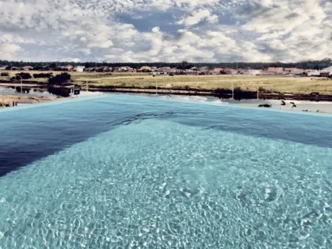 T4 duplex apartment in Vagueira Beach, with a pool and garden